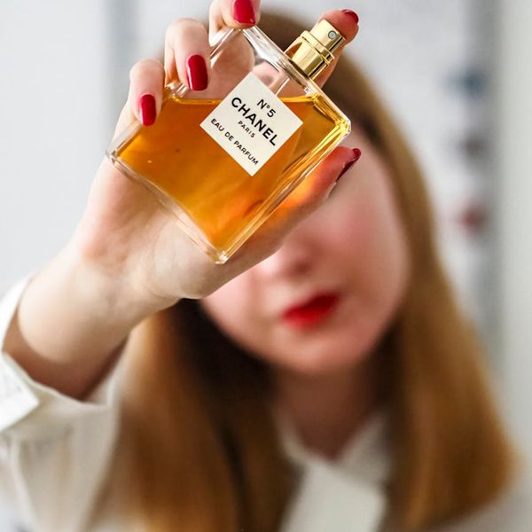 Close up of hands holding a water bottle.